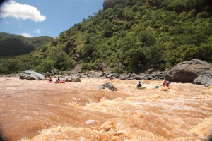 Kayakers and rafters in Simple Simon rapid
